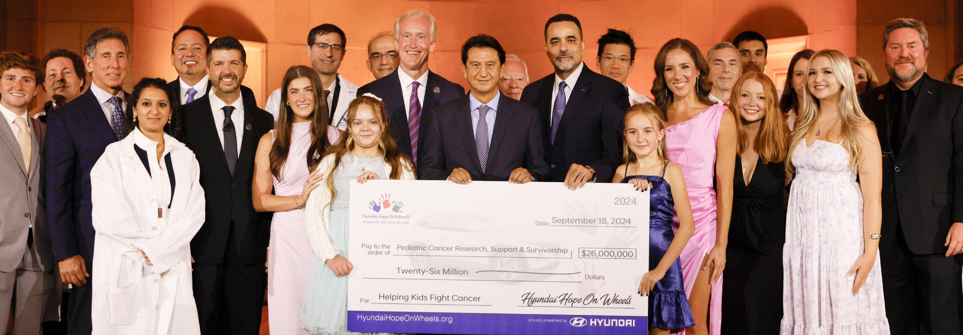 helping kids fight cancer foundation showing their big check from hyundai hope on wheels - CardinaleWay Hyundai in Corona CA